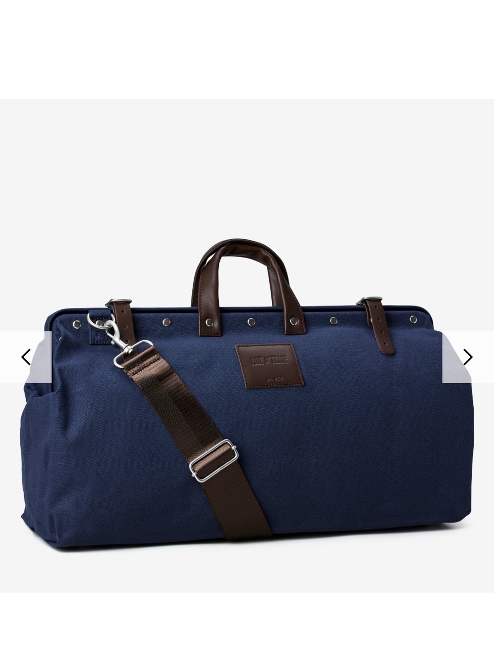 Navy Canvas Duffel Bag with Brown Trim and Adjustable Strap